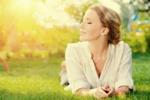 woman smiling and lying peacefully